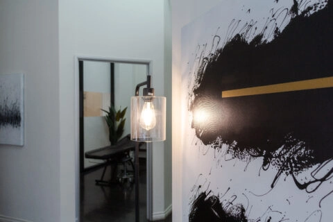Modern interior featuring artwork and a light fixture